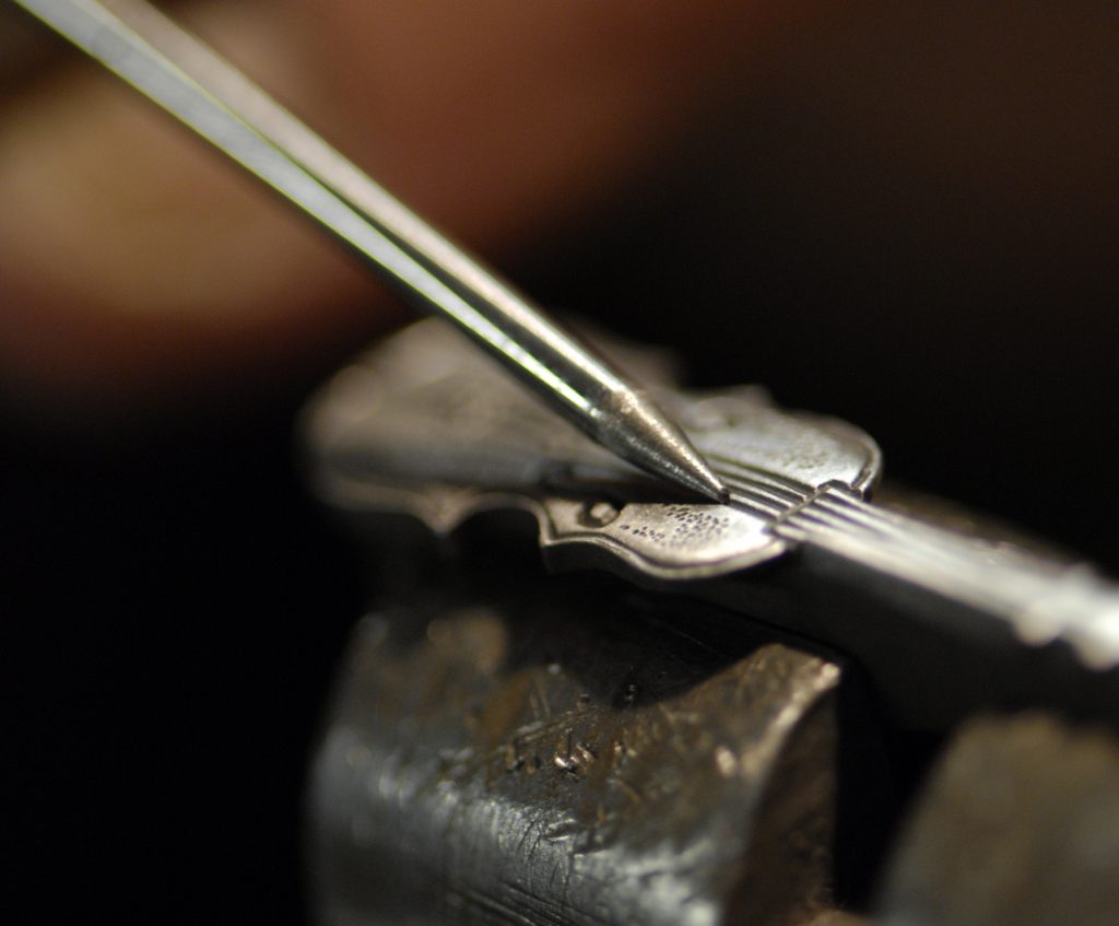 Custom handcarved violin motif on Forge de Laguiole knives